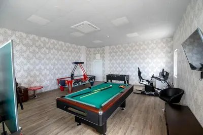 a living room with a pool table in it at Glamping Alliance Hotel in Plovdiv