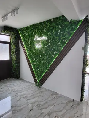 a room with a wall covered in ivy at Вилно селище PARADISE VIEW in Sarnitsa