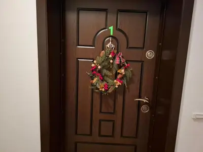 a door with a christmas wreath on it at Diamond Heights apartament in Bansko