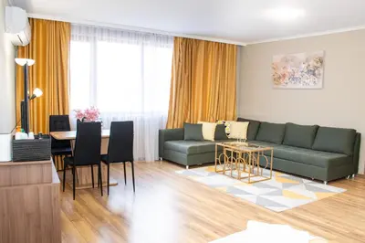 a living room with a couch and a table at !!!1min From The Lift I Luxury Studio In Pirin Palace in Bansko
