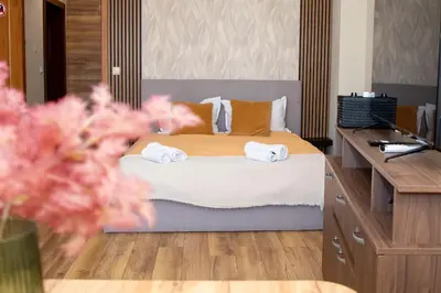 a bedroom with a bed with towels on it at !!!1min From The Lift I Luxury Studio In Pirin Palace in Bansko