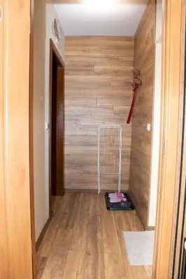 a hallway with a treadmill in front of a wall at !!!1min From The Lift I Luxury Studio In Pirin Palace in Bansko