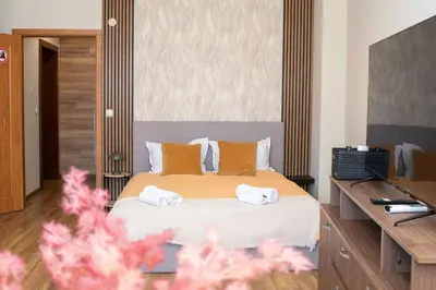 a bedroom with a bed with towels on it at !!!1min From The Lift I Luxury Studio In Pirin Palace in Bansko