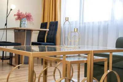 a dining room with a glass table and chairs at !!!1min From The Lift I Luxury Studio In Pirin Palace in Bansko