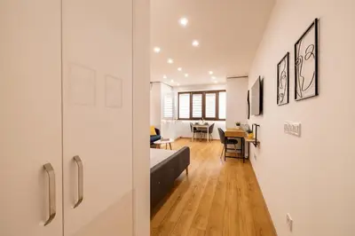 a room with a bed and a dining room at Luxury Studio Living High-End Amenities and Great Location by Flat Mаnager in Sofia
