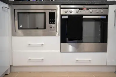 a kitchen with two ovens and a microwave at Peaceful Condo w/ Amazing View in Bansko