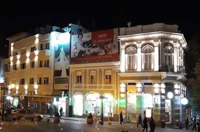 a building on a city street at night at Студио Римски Стадион in Plovdiv
