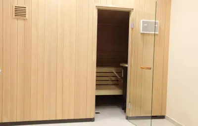 an open door to a room with a bench at Aspen Golf Resort and SPA in Bansko