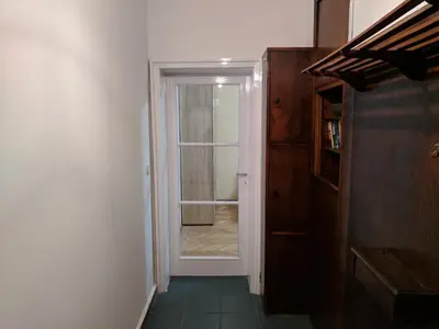 a hallway with a door leading to a room at Convenient New Apartment Near Metro Station by Flat Mаnager in Sofia