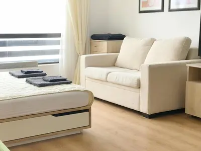 a living room with a bed and a couch at Aspen studio Mountain retreat at Aspen Resort Golf Ski & Spa in Razlog