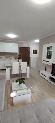 a living room with a couch and a table at Luxury and stylish apartmen, metro station Obelya in Sofia