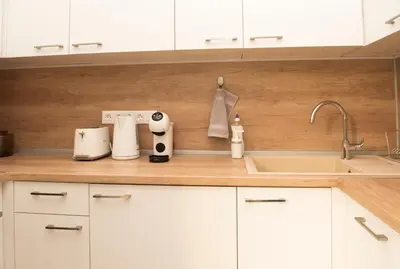 a kitchen counter with a sink and a mixer at Top Center Designer Studio Apartment in Sofia