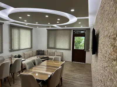 a conference room with a table and chairs and a couch at Villa Siesta Dospat in Dospat