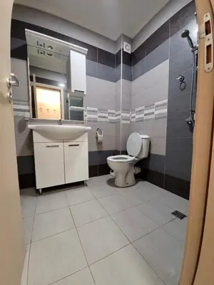a bathroom with a sink and a toilet at Romantic Studio in Sofia