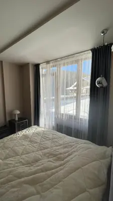 a bedroom with a large bed and a window at Borovets Hills Boro Boro Studio 35m2 in Borovets