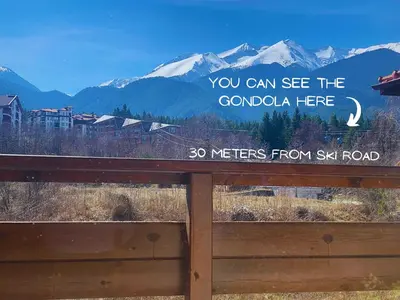 a sign that says you can see the colombia here at Modern Mountain Getaway in Bansko