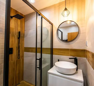 a bathroom with a sink and a mirror at Modern Mountain Getaway in Bansko