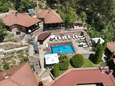 an aerial view of a house with a swimming pool at Safari Village Velingrad in Velingrad