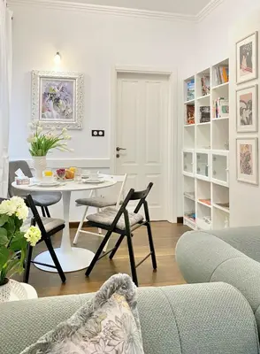 a living room with a table and chairs at Vintage Top Centre Apartment in Sofia