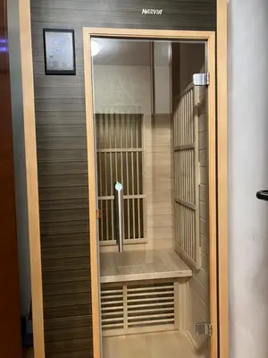 a door to a room with a cell phone in it at Charming Flat in Bansko with Sauna by Flat Mаnager in Bansko