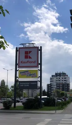 a sign for a kenneland store in a parking lot at Paradise Guest Apartment in Sofia
