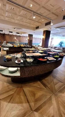 a buffet line with plates of food on a table at Cozy studio with balcony and incl SPA in 4-star hotel Saint Ivan Rilski , Bansko in Bansko