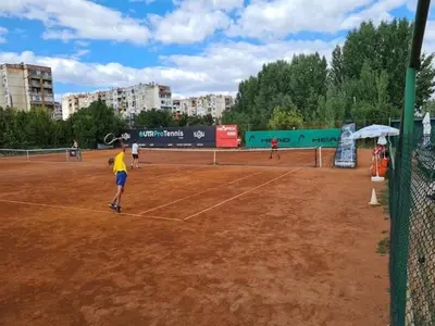 a group of people playing tennis on a tennis court at Superb apartment Free Underground Parking in Pazardzhik