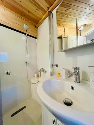 a bathroom with a sink and a shower at Balloon Boutique House, City Centre in Plovdiv