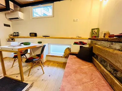 a room with a desk and a table and a window at Balloon Boutique House, City Centre in Plovdiv