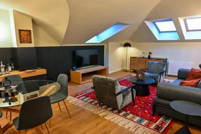 a living room with a couch and a table at Едно Време in Karlovo