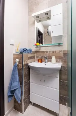 a bathroom with a sink and a mirror at Florance flat next to Old Town & City Center NEW in Plovdiv