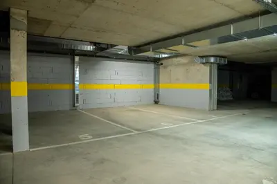 an empty parking garage with a tennis court at Sofia Apartment with Free Parking in Sofia
