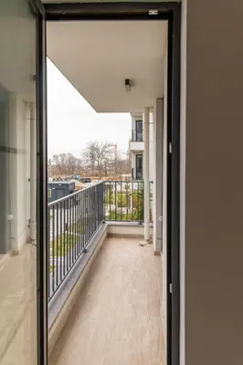 an open door to the balcony of a house at Sofia Apartment with Free Parking in Sofia