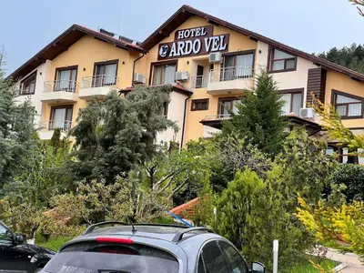 a building with a car parked in front of it at ArdoVel Park Hotel in Velingrad