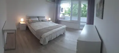 a bedroom with a bed and a large window at 2 bdrm appartment in Sofia - Lulin in Sofia