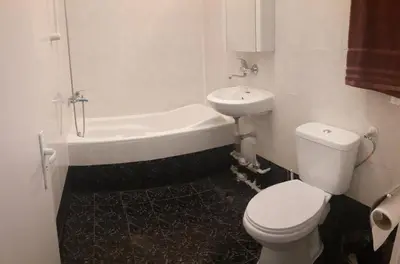 a bathroom with a toilet and a sink and a tub at 2 bdrm appartment in Sofia - Lulin in Sofia
