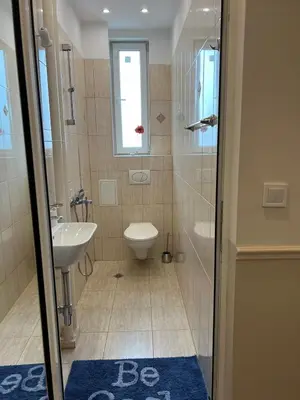 a bathroom with a toilet and a sink at Vitosha 60 in Sofia