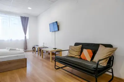 a living room with a couch and a table at 2BD Citrus Apartment, Aristocratic Sofia Living by Flat Mаnager in Sofia