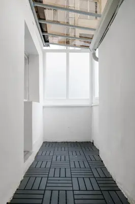 an empty room with a window and a black and white floor at 2BD Citrus Apartment, Aristocratic Sofia Living by Flat Mаnager in Sofia
