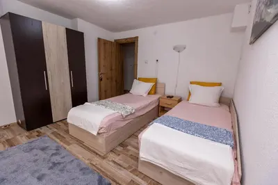 two beds in a small room with at Apartement Hérmitage in Sandanski