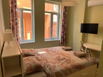 a bed in a room with two pillows on it at Студио Top City Center in Plovdiv