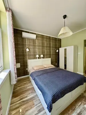 a bedroom with a large bed in a room at Студио Top City Center in Plovdiv
