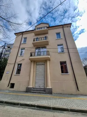 a tall building with a staircase in front of it at Cozy Studio in Center of Sofia in Sofia