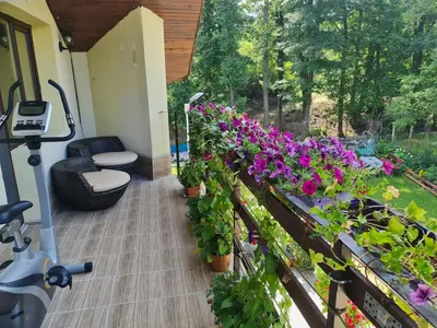 a balcony with plants and flowers on a house at Villa Janet in Dolna Banya