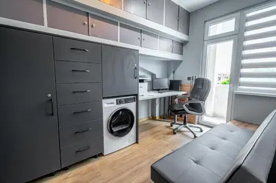 a kitchen with a washer and dryer in a room at Vitoshka's Finest in Sofia