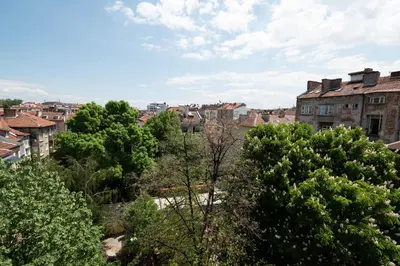 a view of a city with trees and buildings at Vitoshka's Finest in Sofia