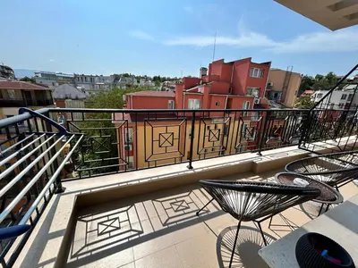 a balcony with chairs and a railing on a building at Old Town Apartment 3 with Free Private Parking in Plovdiv
