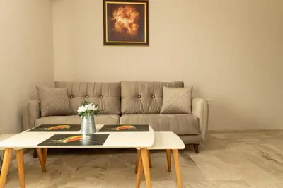 a living room with a couch and a table at Old Town Apartment 3 with Free Private Parking in Plovdiv