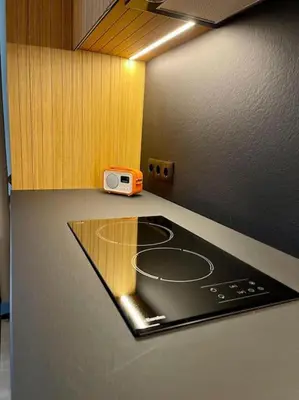 a kitchen with a counter top with a microwave on it at Luxury 2 Bedroom Top Central Apartment in Sofia