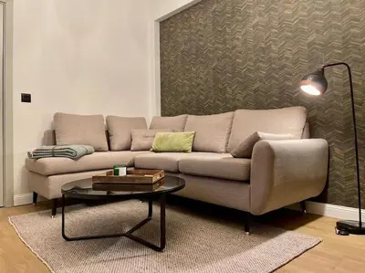 a living room with a couch and a table at Luxury 2 Bedroom Top Central Apartment in Sofia